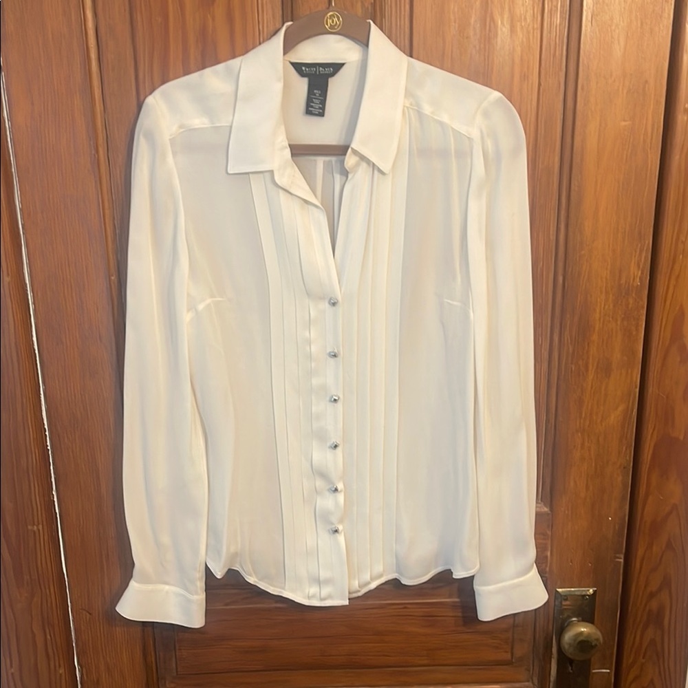 White House Black Market White Silk Long Sleeve Shirt with silver accents.
